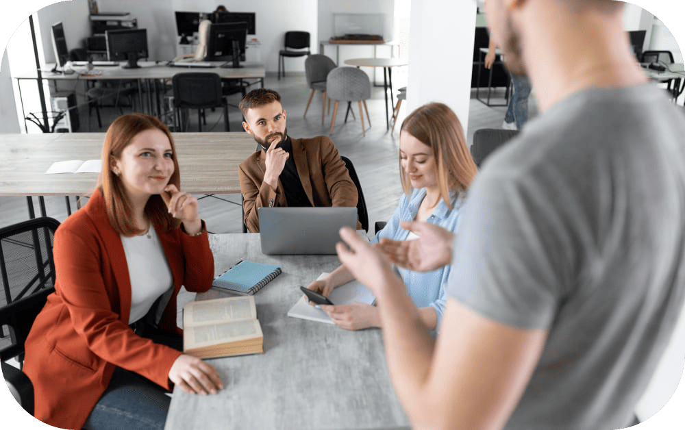 A group of professional crypto SEO consultants brainstorming around a conference table, with laptops and charts showcasing keyword rankings and traffic growth, highlighting their expertise in cryptocurrency marketing.